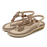 Sandalias planas de mujer – Estilo boho chic – Cuentas de madera – Tira trenzada en el tobillo