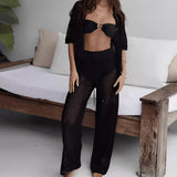 Conjunto de punto para mujer: corte holgado, punto calado, top de manga corta con botones, pantalón recto con cintura con cordón.