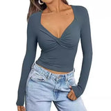 Top de mujer – Cuello en V – Corte ajustado – Manga larga – Corto con detalle de giro