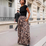 Falda larga de mujer – Pliegues fluidos – Estampado llamativo – Elegante corte acampanado