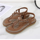Sandalias planas de mujer – Estilo boho chic – Cuentas de madera – Tira trenzada en el tobillo