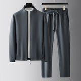 Chándal de hombre – Corte holgado – Chaqueta con cremallera y cuello alto – Pantalón con cintura elástica