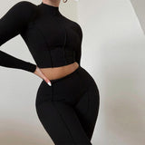 Conjunto deportivo para mujer: tejido elástico acanalado, top corto de manga larga y leggings de cintura alta.