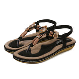 Sandalias planas de mujer – Estilo boho chic – Cuentas de madera – Tira trenzada en el tobillo