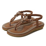 Sandalias planas de mujer – Estilo boho chic – Cuentas de madera – Tira trenzada en el tobillo