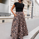 Falda larga de mujer – Pliegues fluidos – Estampado llamativo – Elegante corte acampanado