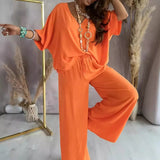Conjunto de dos piezas para mujer: tejido transpirable, top con cuello en V y pantalón ancho.