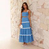 Conjunto de dos piezas para mujer: Top tipo bustier ajustado, falda larga con volantes y tejido ligero.