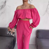 Conjunto de dos piezas para mujer: Top con hombros descubiertos, mangas largas y pantalones anchos de cintura alta.