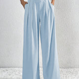 Pantalón ancho de mujer – Cintura alta – Tejido ligero – Corte fluido con pliegues y bolsillos