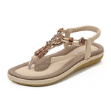 Sandalias planas de mujer – Estilo boho chic – Cuentas de madera – Tira trenzada en el tobillo