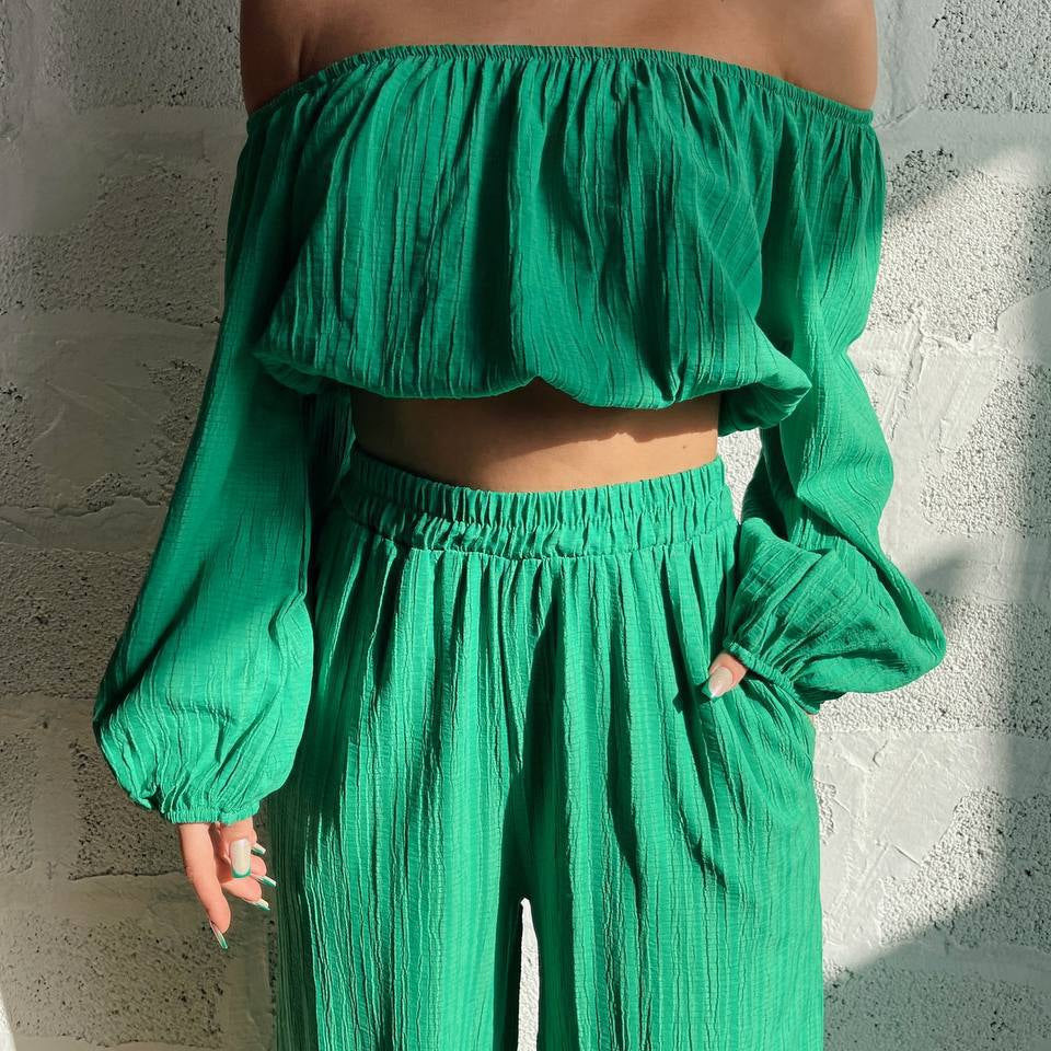 Conjunto de dos piezas para mujer: Top con hombros descubiertos, mangas largas y pantalones anchos de cintura alta.