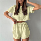 Conjunto de dos piezas para mujer: top corto y shorts, tejido transpirable, corte holgado.