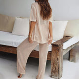 Conjunto de punto para mujer: corte holgado, punto calado, top de manga corta con botones, pantalón recto con cintura con cordón.
