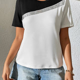 Camiseta de mujer – Corte holgado – Punto suave – Cuello redondo – Detalle de lentejuelas