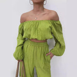 Conjunto de dos piezas para mujer: Top con hombros descubiertos, mangas largas y pantalones anchos de cintura alta.