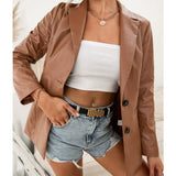 Gabardina de mujer – Corte entallado – Largo hasta la mitad del muslo – Cuello clásico con muesca