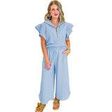 Conjunto informal para mujer: Top con cuello camisero y volantes con cremallera y pantalón ancho con cordón.