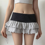 Minifalda ajustada con volantes, patchwork de lunares y bloques de color.