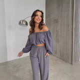 Conjunto de dos piezas para mujer: Top con hombros descubiertos, mangas largas y pantalones anchos de cintura alta.