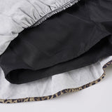 Falda corta con estampado de leopardo y lazo de encaje con volantes