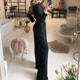 Mono de mujer – Corte entallado – Mangas largas – Tejido fluido y elegante – Piernas anchas