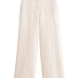 Conjunto de mujer: Chaqueta corta abotonada de manga corta y pantalón ancho de sastre.