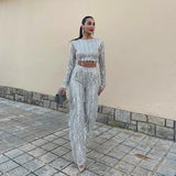 Conjunto de top corto y pantalón para mujer: mangas largas, cintura alta, acampanado y adornado.