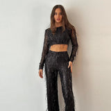 Conjunto de top corto y pantalón para mujer: mangas largas, cintura alta, acampanado y adornado.