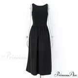 Vestido midi trapecio sin mangas con cuello redondo, corte en A, ideal para verano, fiestas casuales en la playa o discotecas.