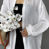 Blusa casual chic lisa de manga larga