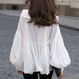 Blusa vintage con cuello bebé plisado y mangas abullonadas
