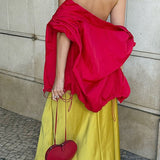 Vestido largo asimétrico con espalda abierta transparente y ribete de encaje satinado.