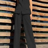 Pantalón ancho fluido con blazer sin mangas a juego