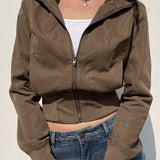 Chaqueta utilitaria con cinturón y bolsillos con cremallera.