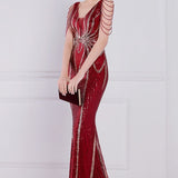 Vestido de noche sirena con lentejuelas y cuentas florales.