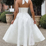 Vestido de noche jacquard con espalda abierta y escote en pico