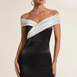 Vestido de noche blanco y negro con hombros descubiertos