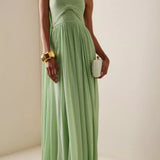 Elegante vestido largo sin tirantes con lazo fruncido