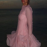 Elegante mini vestido con botones y volantes, mangas largas abullonadas.