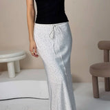 Falda maxi sirena asimétrica con lunares