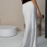 Falda maxi sirena asimétrica con lunares