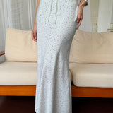 Falda maxi sirena asimétrica con lunares