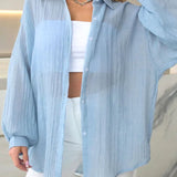 Blusa casual chic lisa de manga larga