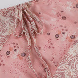 Falda midi asimétrica con volantes florales