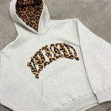 Sudadera con capucha forrada con estampado de leopardo y letras bordadas