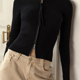 Blusa de punto con doble cremallera y cuello alto