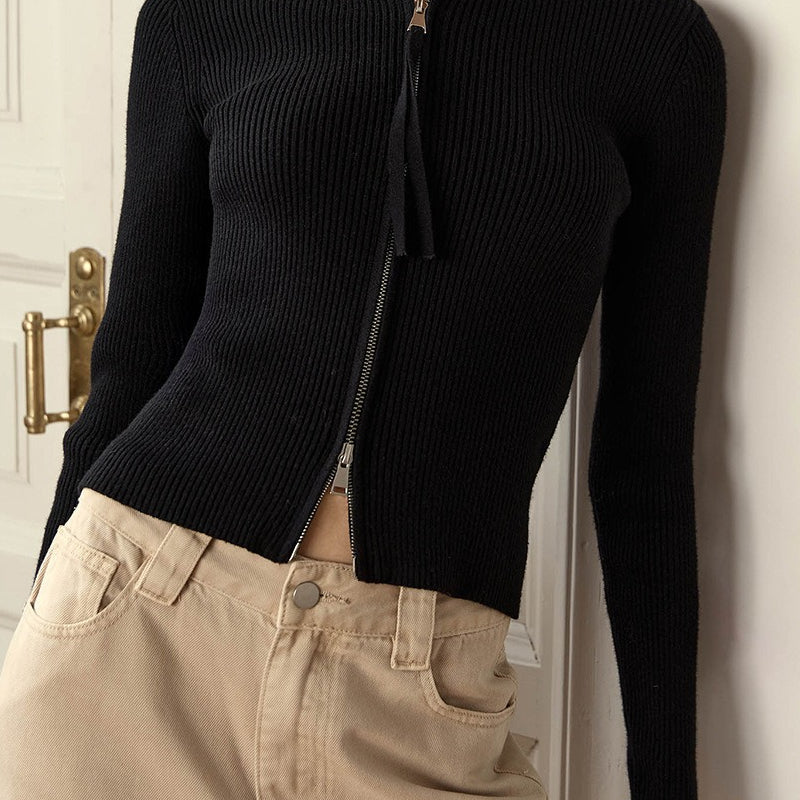 Blusa de punto con doble cremallera y cuello alto