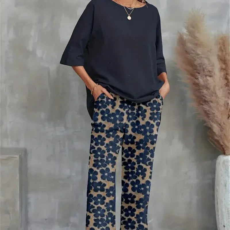 Conjunto elegante de top asimétrico y pantalón ancho con estampado floral para mujer