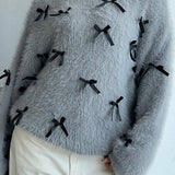 Suéter de mohair con pajarita, blusa holgada